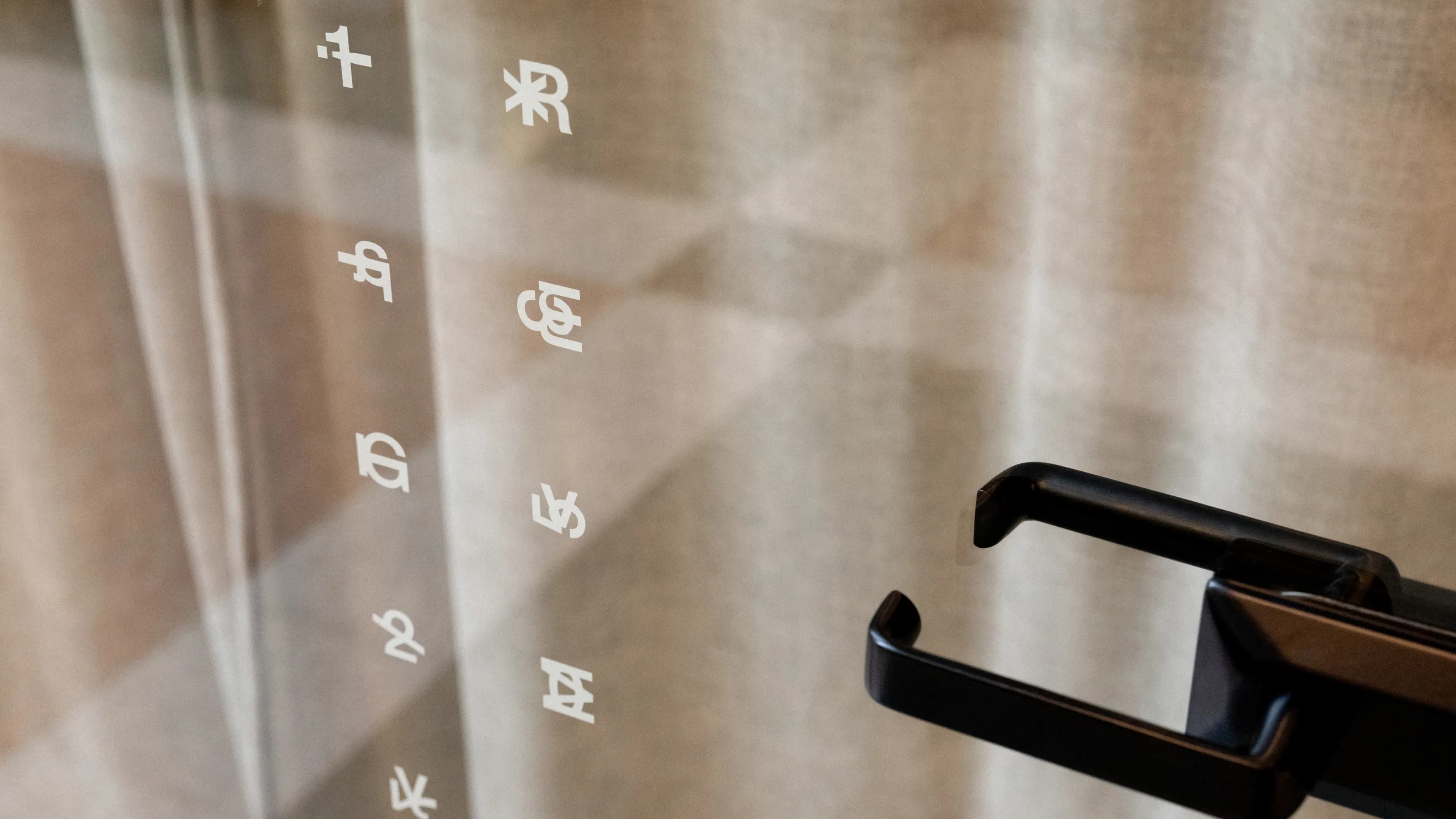 Glyphs on door from custom typeface designed by Norwegian agency ANTI for Norwegian art space Gallerylab