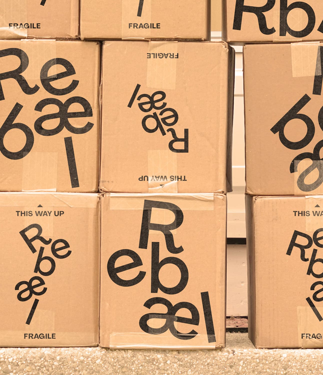 Cardboard boxes of Rebel stacked on top of each other