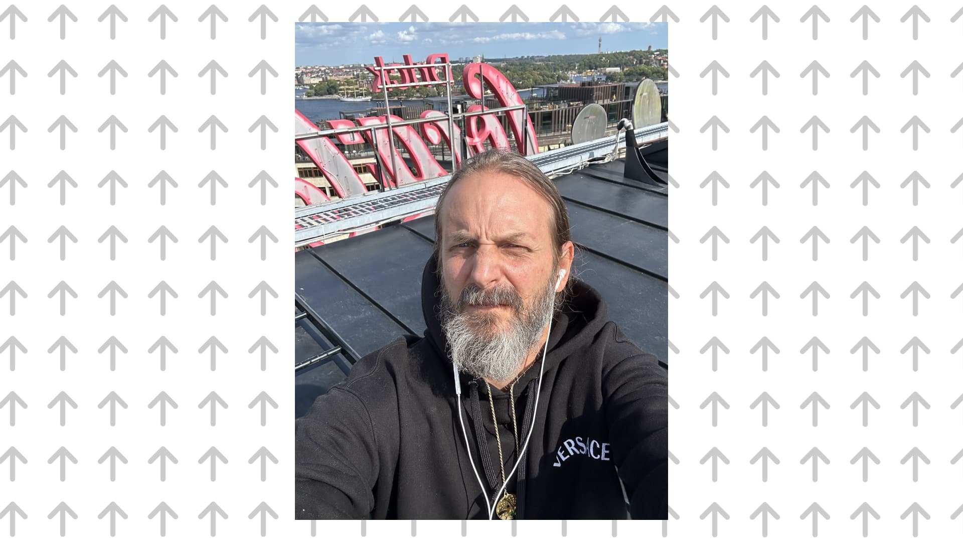 Portait of Moses Voigt taking a selfie on a roof