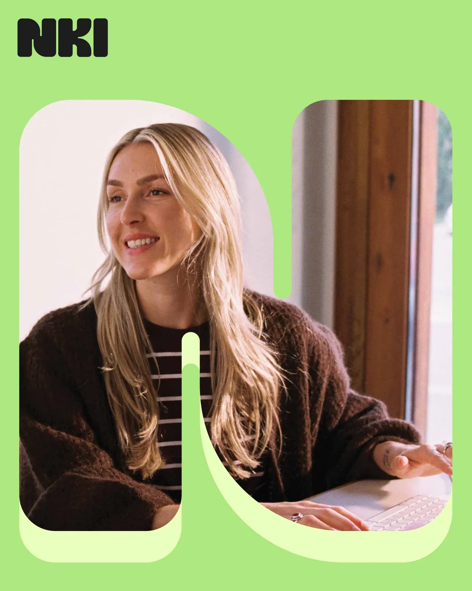 Poster on a light-green background with the black NKI logo top left. A smiling woman with long blonde hair in a striped top is framed inside a large rounded letter N used as an image mask.