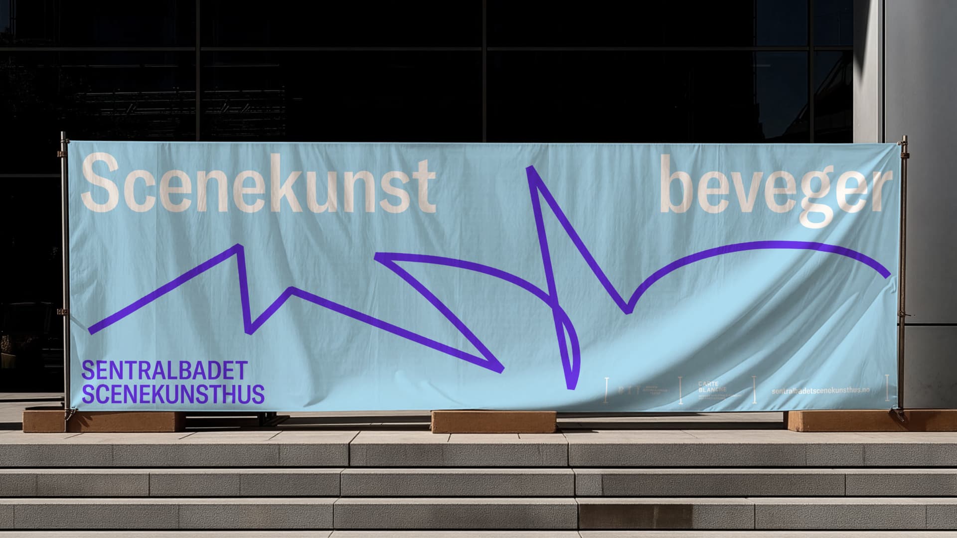 Large outdoor banner on a building façade reading 'Scenekunst beveger' ('performing arts moves'), with a purple line drawing and the Sentralbadet Scenekunsthus logo – outdoor advertising from the new visual identity.