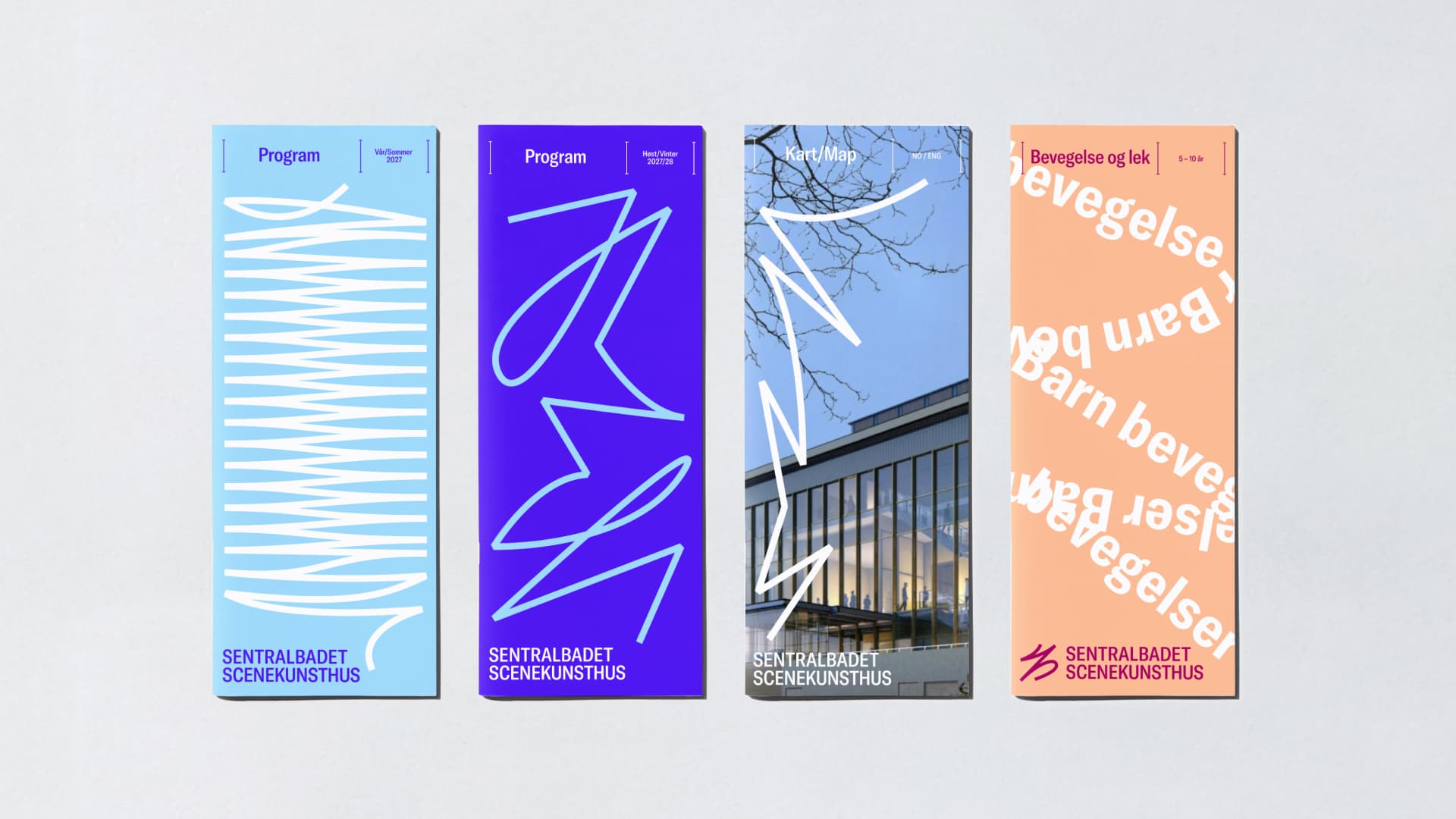 Four printed programme booklets for Sentralbadet Scenekunsthus: two with white line drawings on light blue and purple backgrounds, one featuring a photo of the building ('Kart/Map'), and one in peach with a rotated text pattern ('Bevegelse og lek').