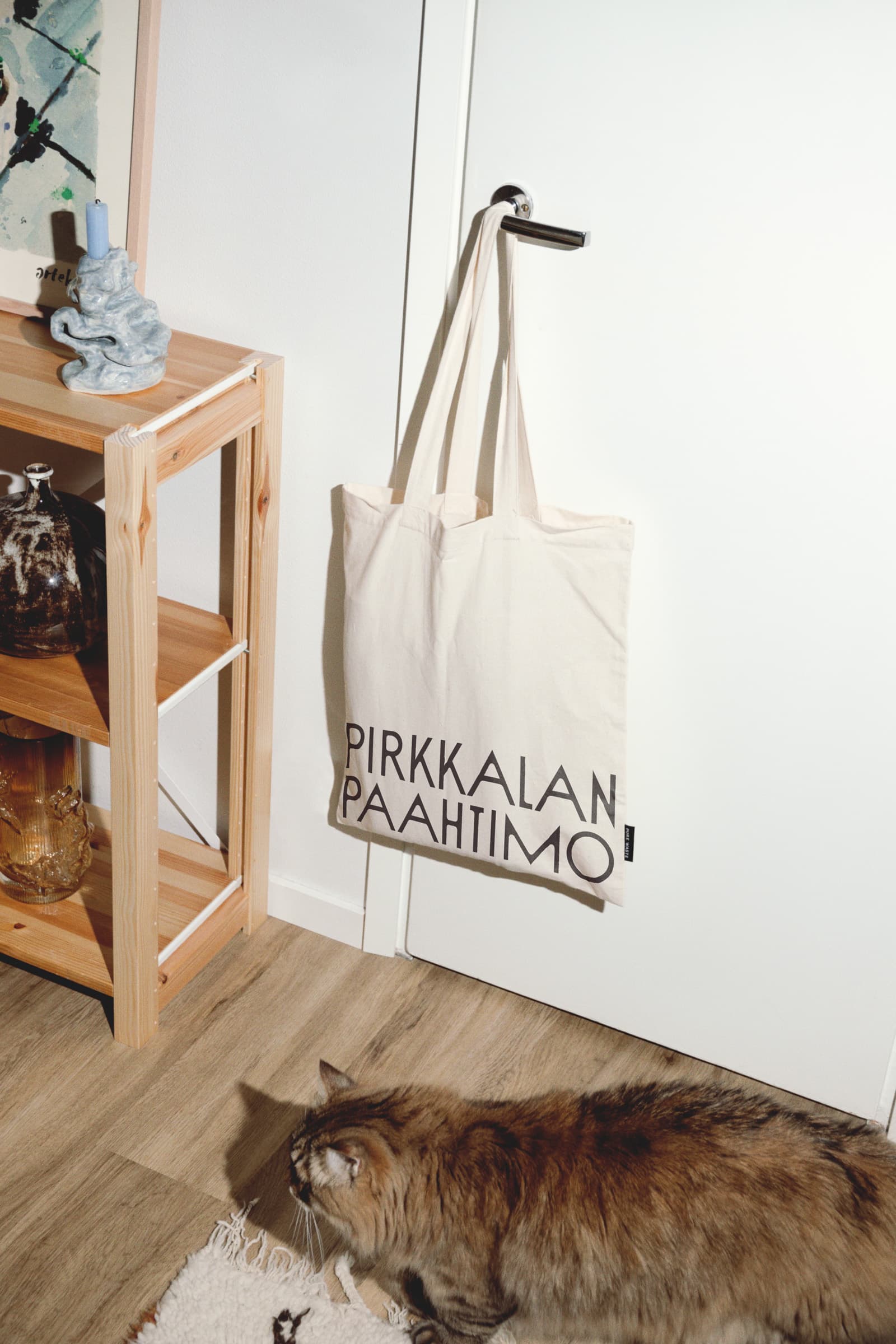 Tote bag from Pirkkalan hanging on a door
