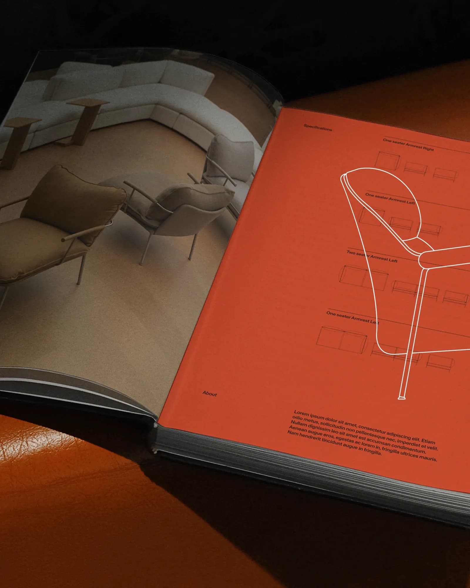 Open Fogia catalogue resting on an orange leather chair: a curved sofa spread on the left page and an orange 'Specifications' armrest diagram spread on the right.