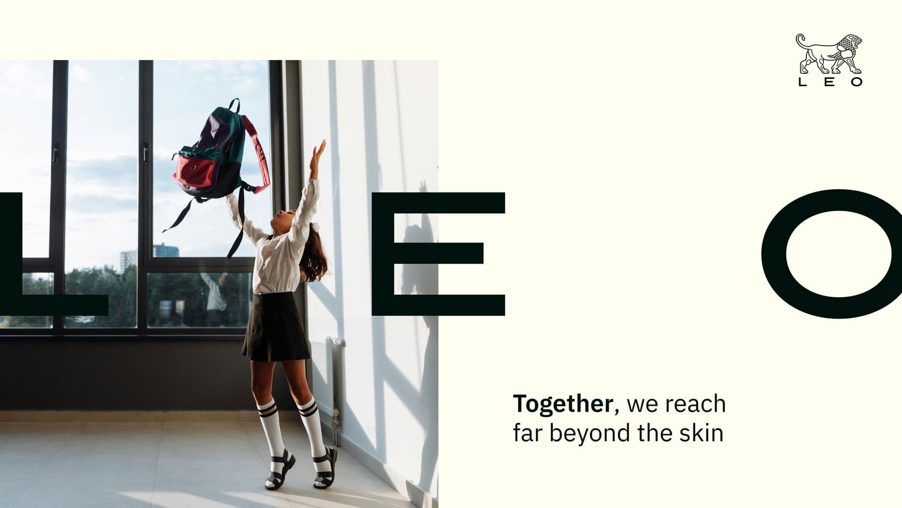 LEO Pharma brand layout: Girl in school uniform tossing her backpack into the air in front of large windows. LEO logotype and tagline integrated into the design.