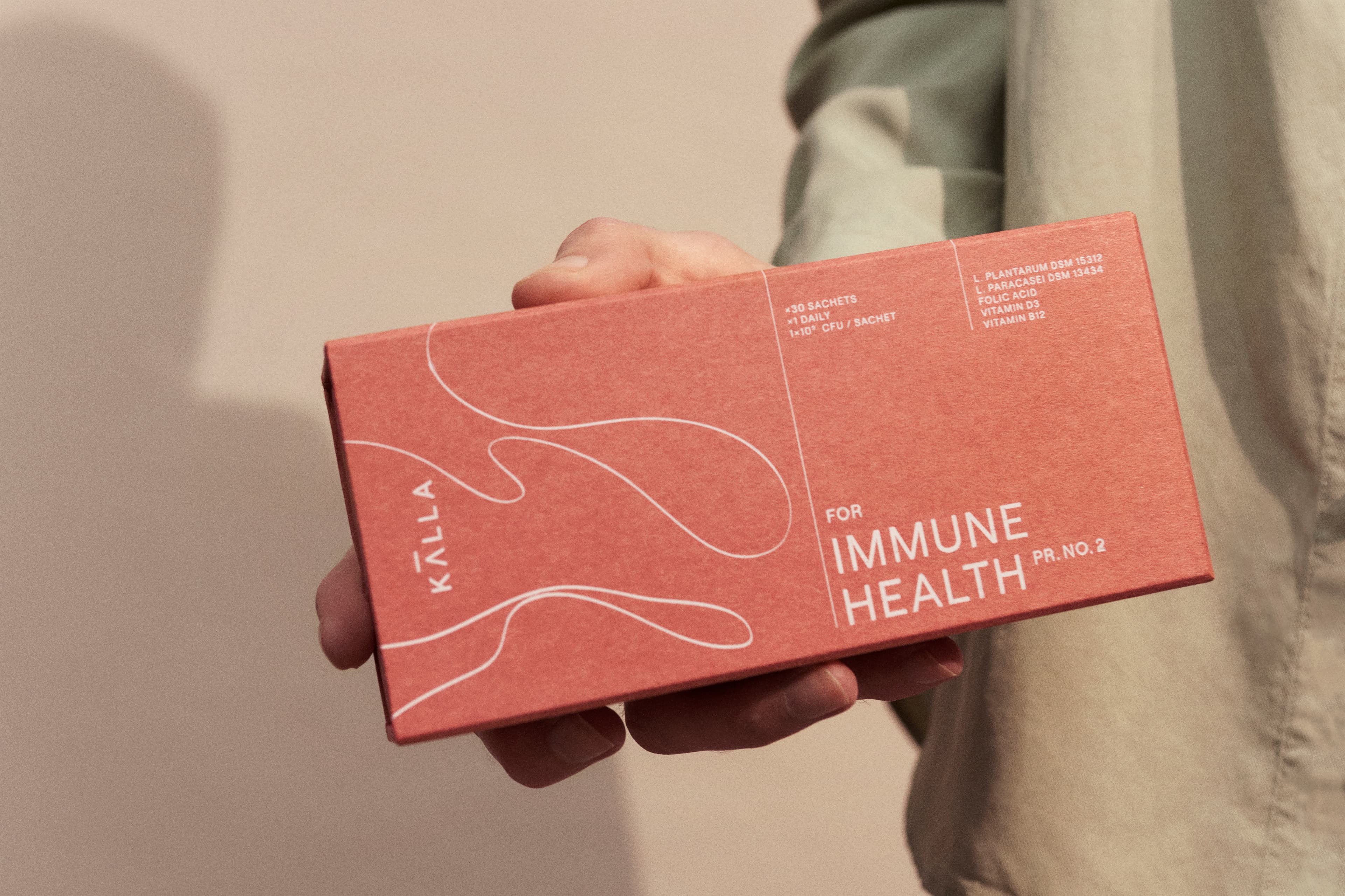 Man holding a pack of probiotics from Kill