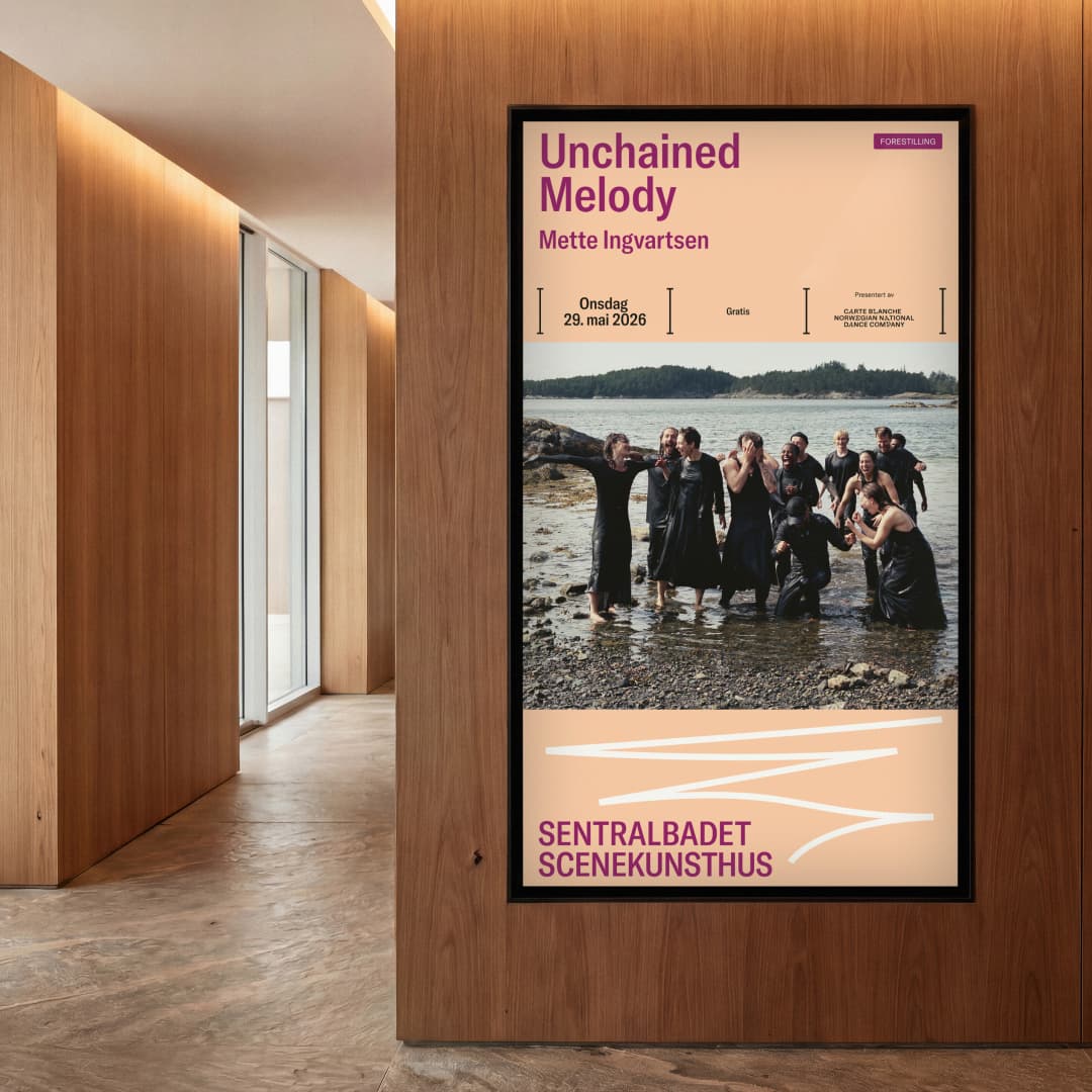 Digital screen on a wood-panelled foyer wall displaying the poster for 'Unchained Melody' by Mette Ingvartsen, featuring a photo of dancers in water by a shoreline and the Sentralbadet Scenekunsthus logo.