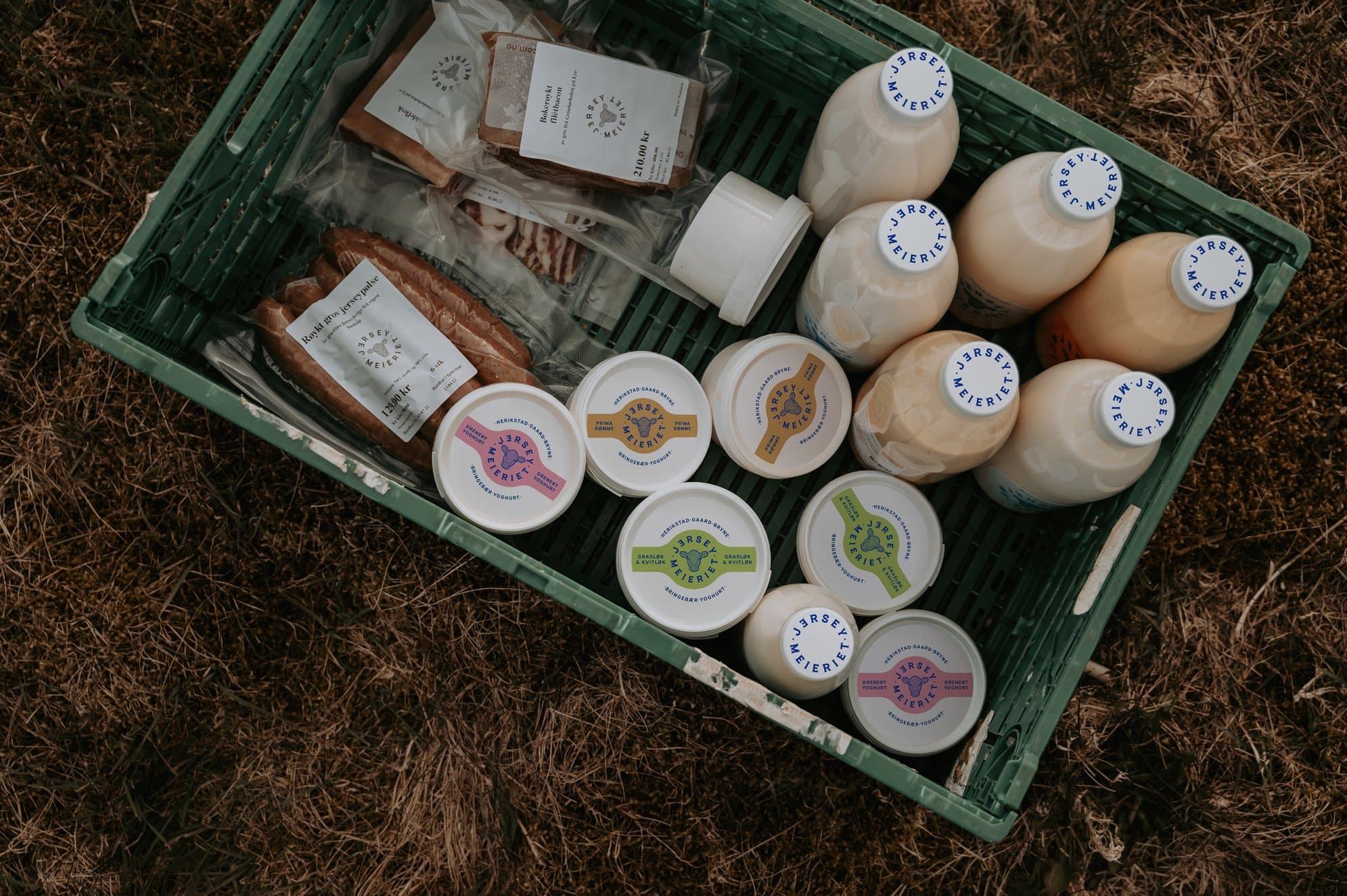 Top-down photograph of box filled with products from Norwegian dairy farm Jerseymeiriet