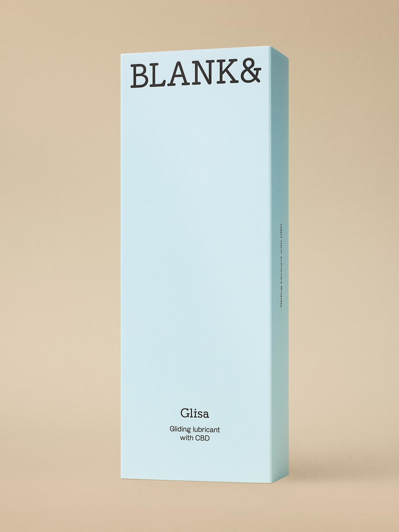 Light blue packaging for Blank& Glisa, a gliding lubricant with CBD, shot standing against a beige background.